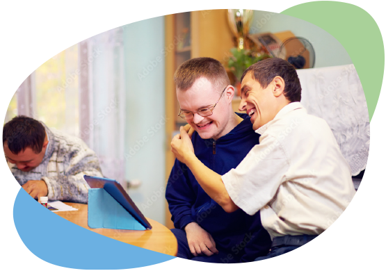 Care staff hugging disabled client